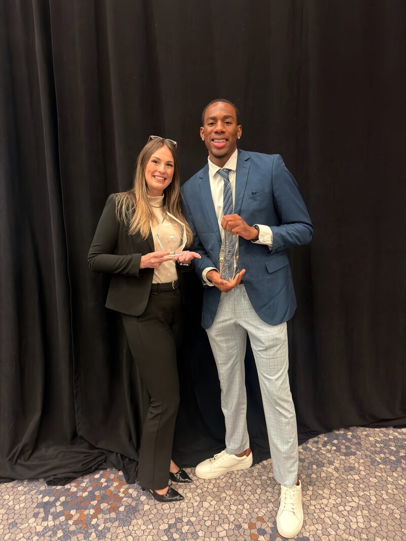 BG Horizon team members with a company award