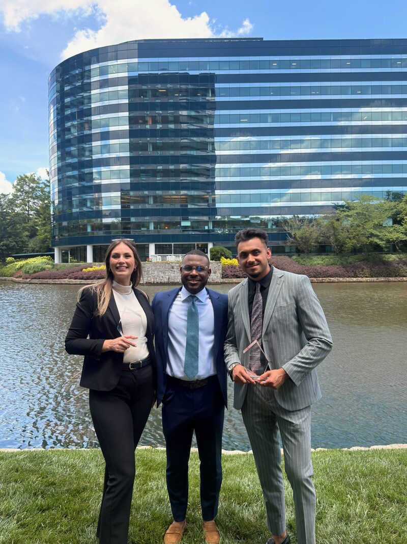 BG Horizon team members celebrating an award outside their office